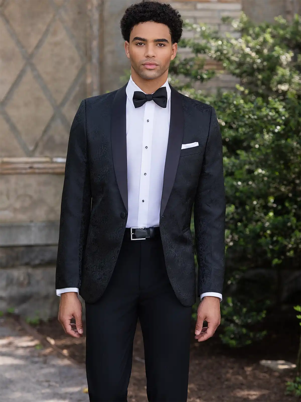 Man in a black tuxedo by Mark of Distinction